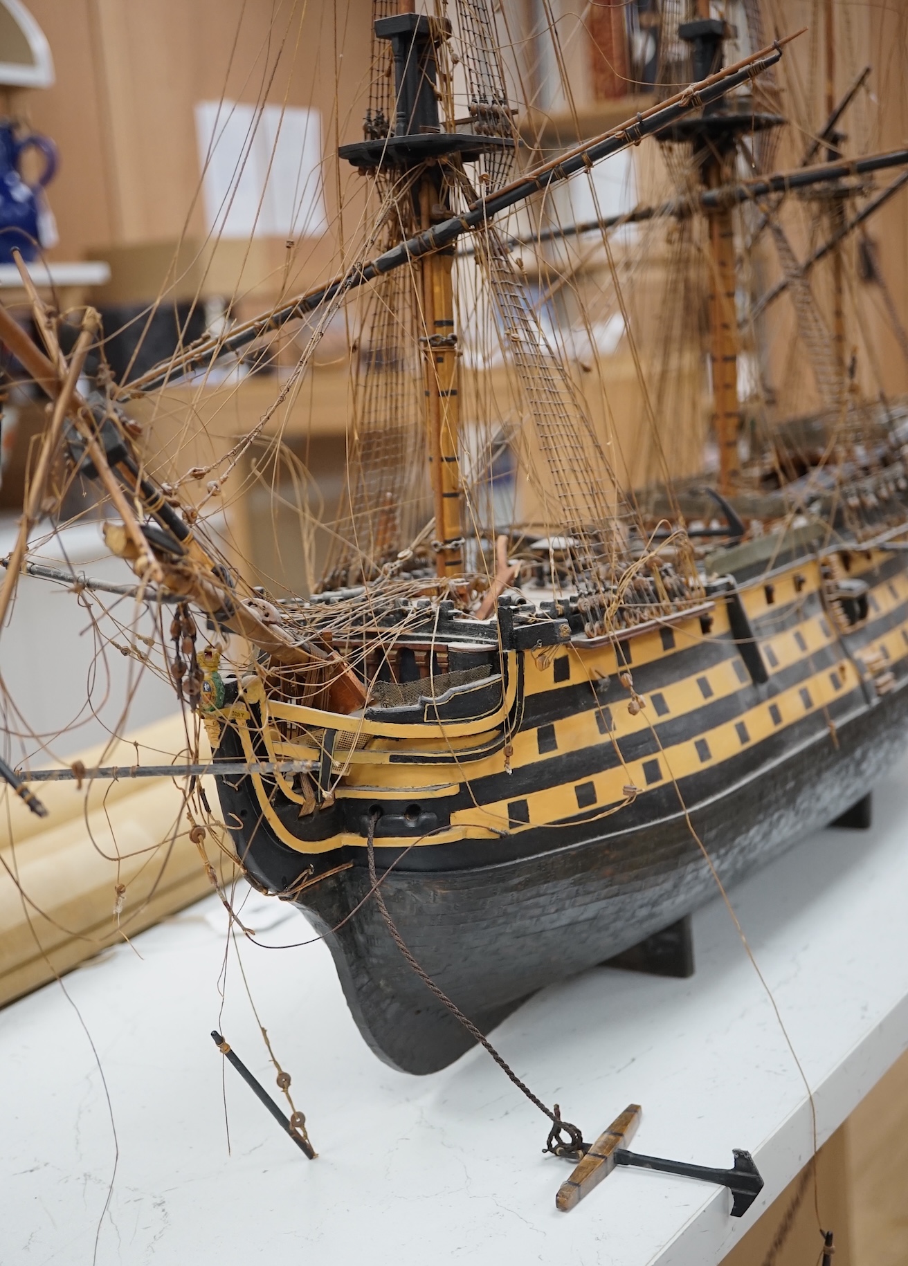 A large model of a rigged ship, 84cm long. Condition - fair